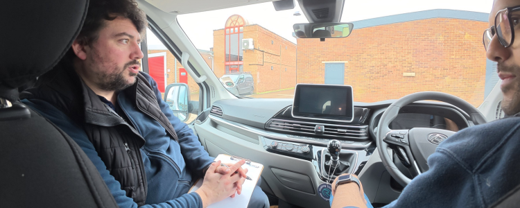 A driver recieves feedback from an instructor during MiDAS driver training
